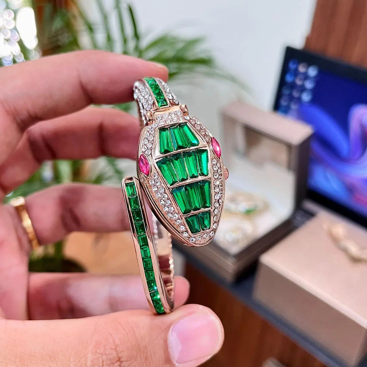 Side angle showing snake-head case of Bvlgari Serpenti watch