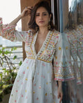 Close-up of embroidery and lace border on gown