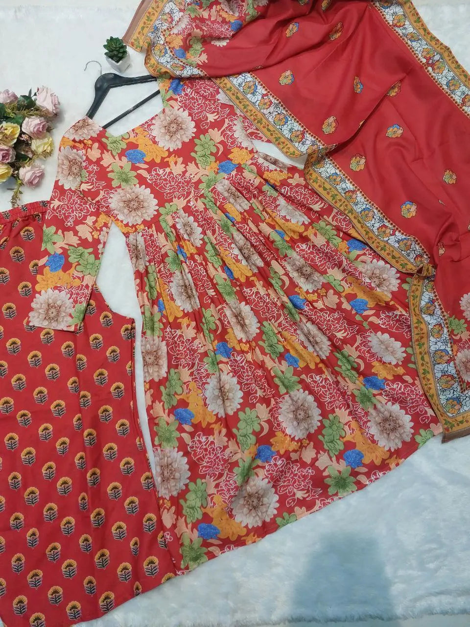 Traditional women’s red suit with dupatta