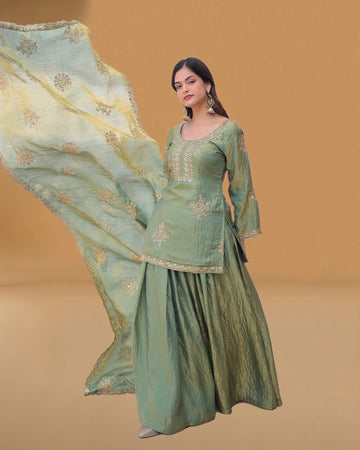 Close view of zari embroidery on kurti
