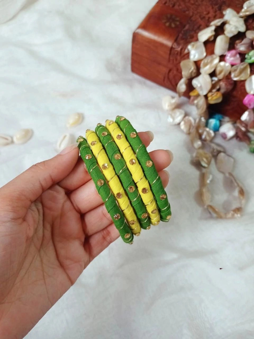 Handmade green and yellow fabric bangle set with stone work from Berhampore, Murshidabad