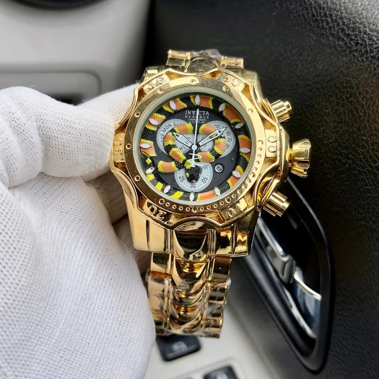 Side view showing gold finish and chronograph buttons
