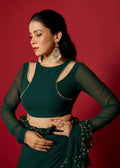 Front view of party wear ready-to-wear green saree