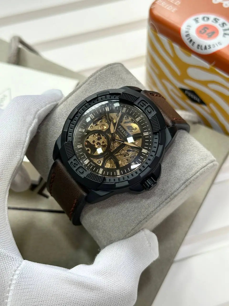 Fossil 7AAA Automatic Watch for Men – This luxury automatic watch features a brown leather strap and skeleton dial, offering precision and style from the 7AAA Premium Collection.