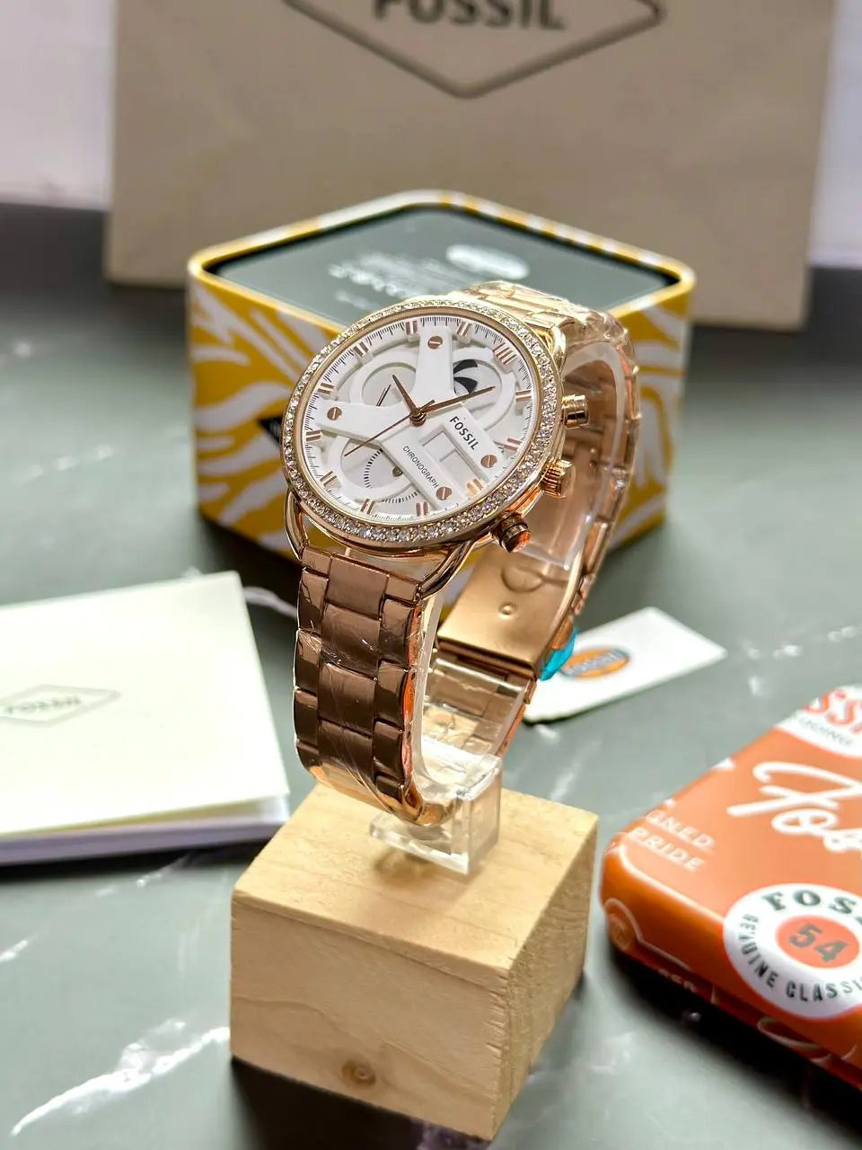 Fossil Women's Rose Gold Watch – A stylish and unique watch with a 12-hour dial, 7A quality, and an eye-catching, uniquely shaped case for a standout design.