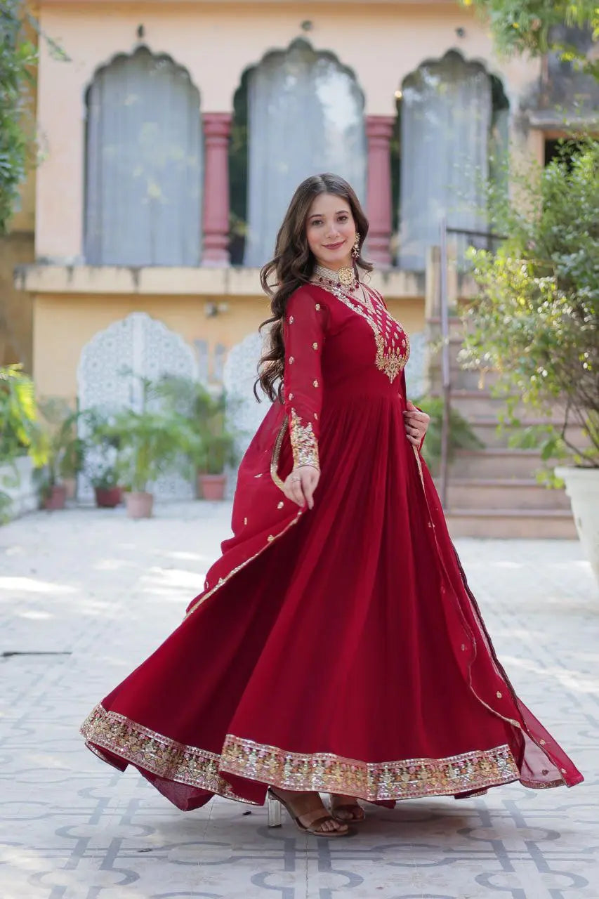 Designer Faux Gown in Maroon & Pink – Stylish ethnic wear with rich embroidery and a fancy V-neck.