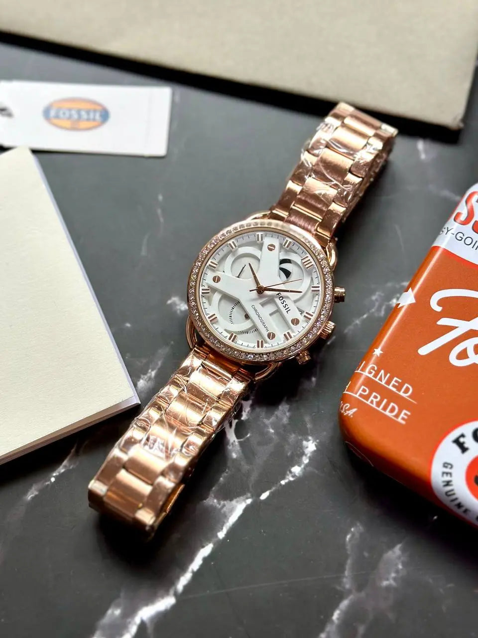 Fossil Women's Premium Rose Gold Watch – A luxurious timepiece with a unique-shaped case, 12-hour dial, and premium 7A quality craftsmanship for a sophisticated look.