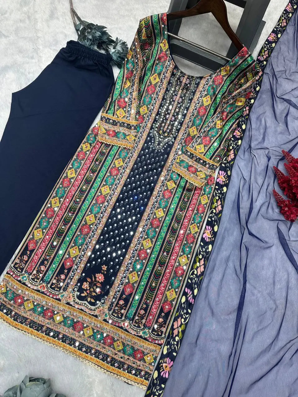 Stunning new fancy design top, bottom, and dupatta set featuring digital prints and mirror handwork for a chic look.