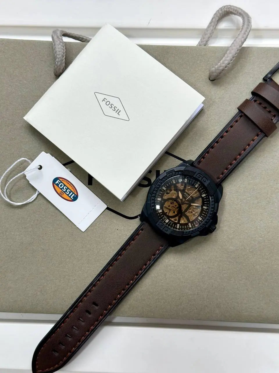 Fossil Men's Watch – Brown Leather Strap & Skeleton Dial – This 7AAA Premium Collection automatic watch combines a brown leather strap with a unique skeleton dial for a bold and elegant style.