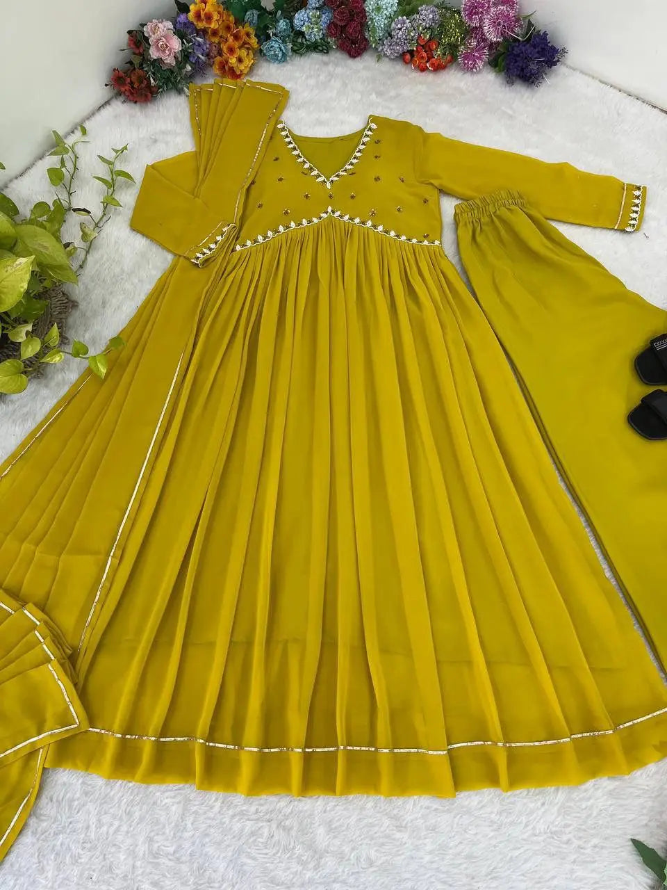 Graceful embroidered gown with golden lace dupatta for a festive look