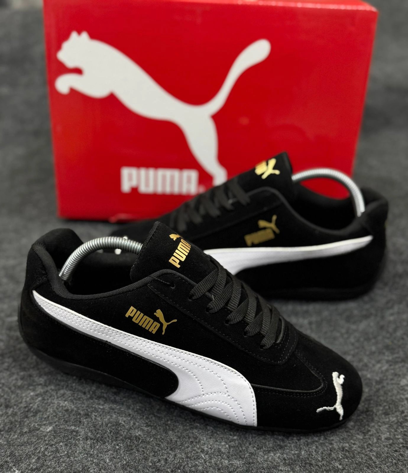 Black and white Puma sneakers for daily wear and outings
