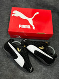 Puma men sneakers black color with white stripe side view