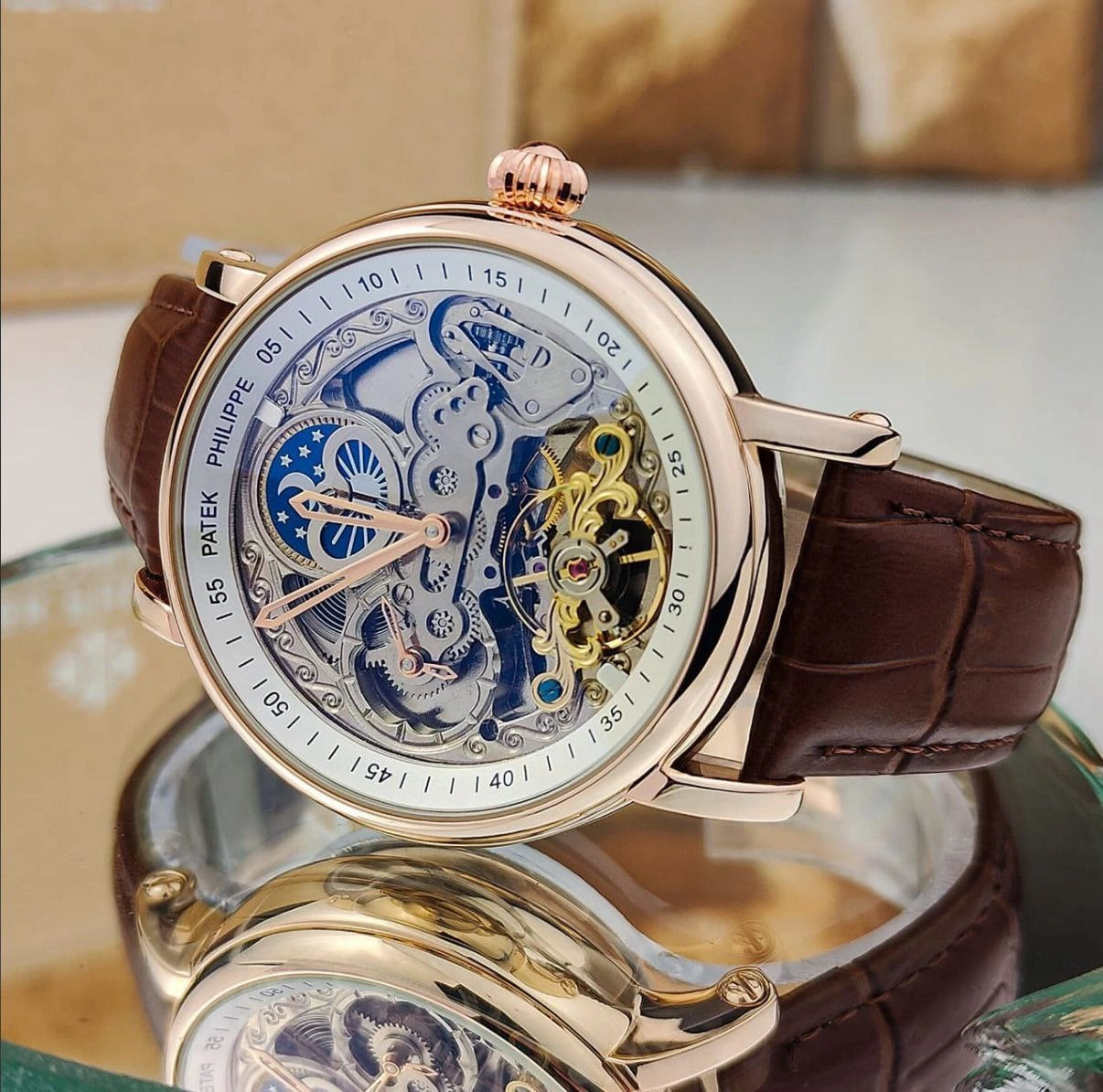 Rose-tone case men's wristwatch dial close-up
