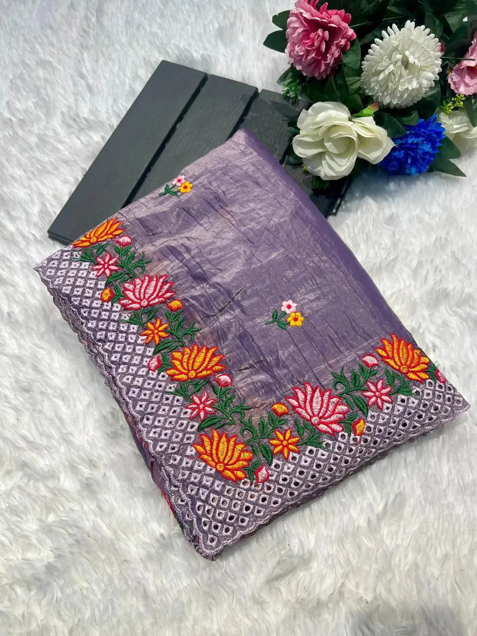 Close-up of saree arc-cut embroidered border