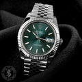 Silver bracelet green dial watch
