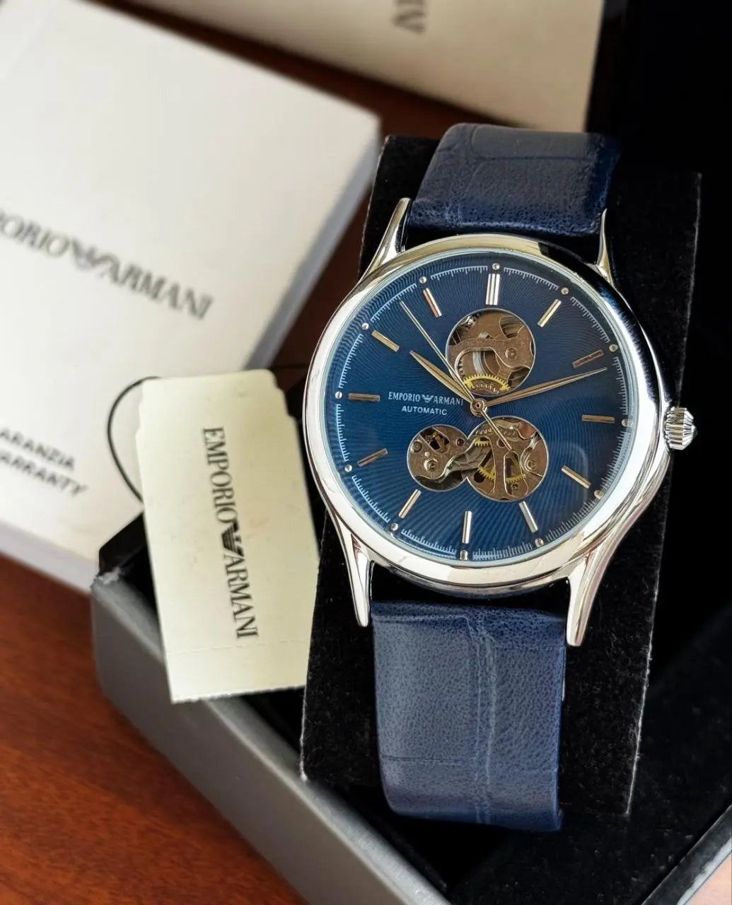 Side profile of silver-tone automatic Armani watch
