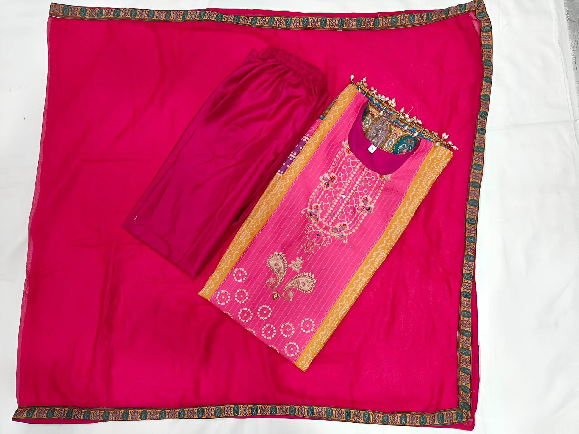 Pakistani salwar suit with moti lace