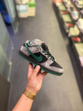Black and grey streetwear sneakers with green swoosh