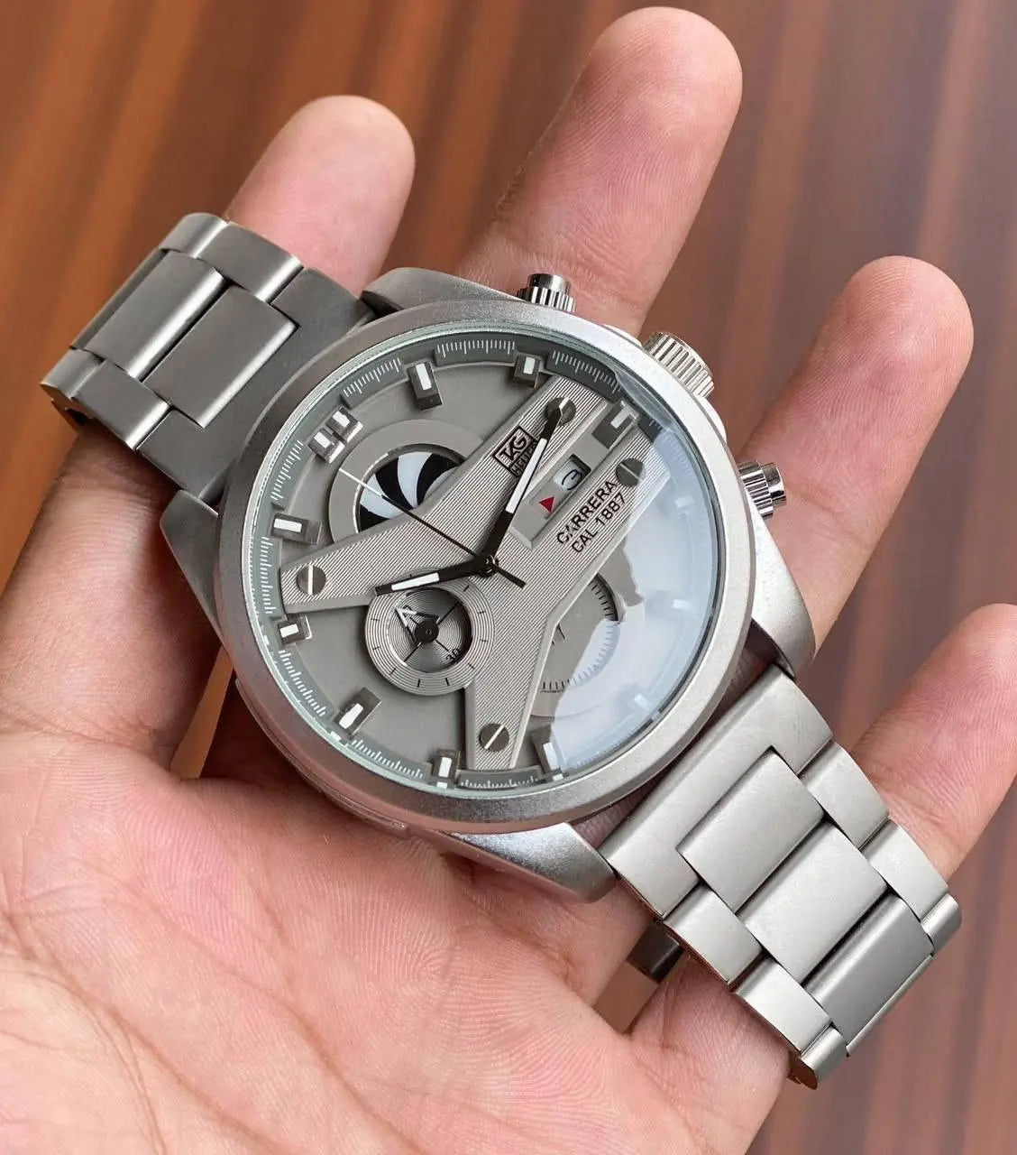 Sporty & Sophisticated Timepiece – The Tag Heuer CR7 watch blends a sleek grey dial with a durable silver case and functional chronograph for an elevated look.